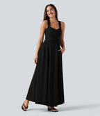 Robe longue fluide décontractée sans manches décolleté en cœur bretelles croisées avec lien dans le dos et poches