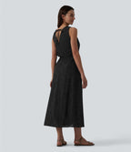 Robe mi-longue fluide col V sans manches avec nœud au dos