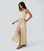 Robe longue fluide fendue avec poches latérales, dos nu et effet torsadé