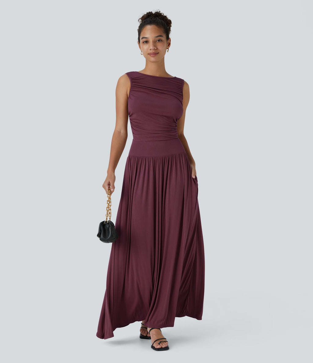 Robe longue à encolure bateau, bretelles asymétriques, côtés froncés et poches