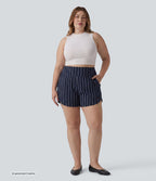 Short rayé grande taille taille haute avec ourlet arrondi et poches