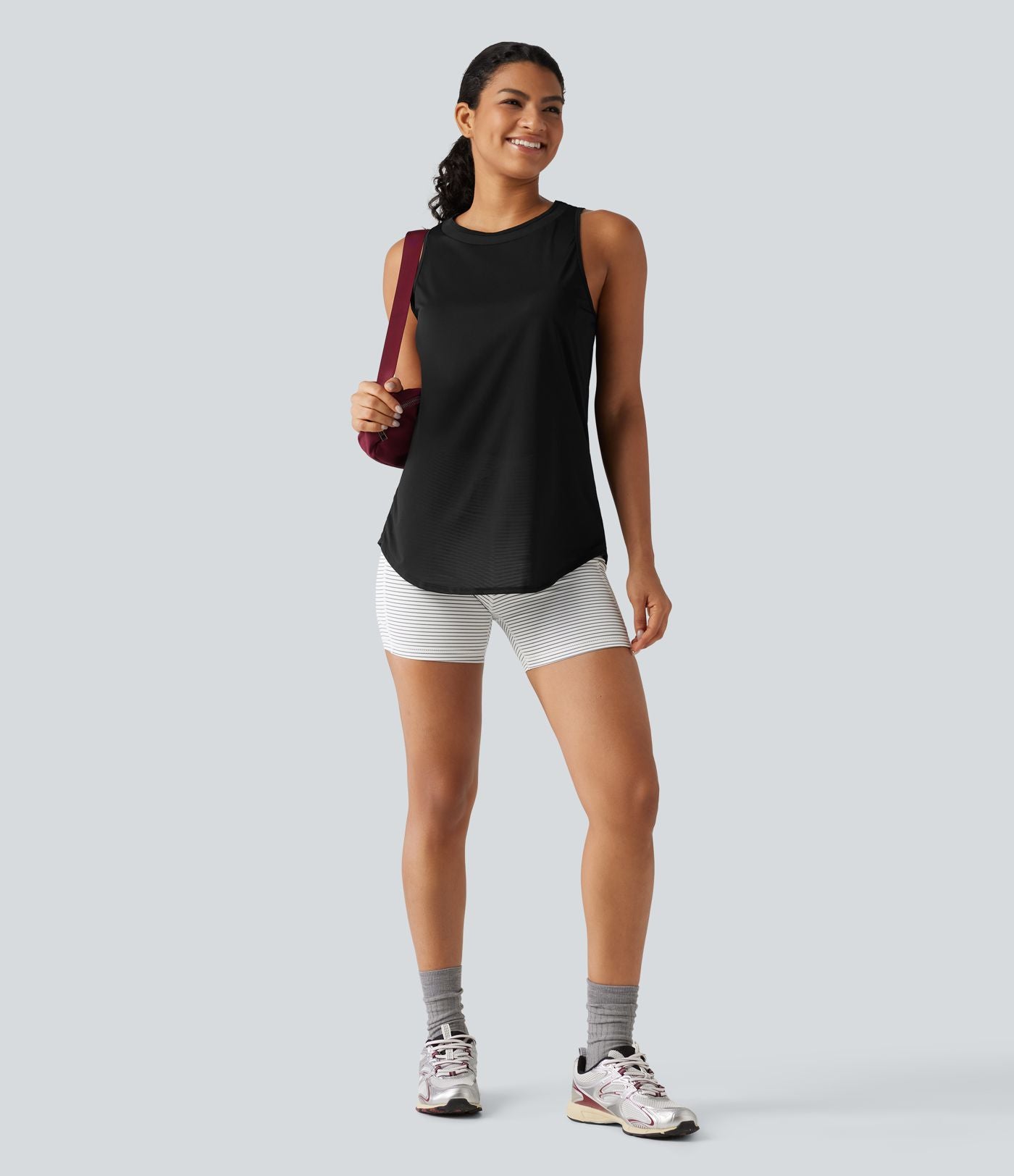 Débardeur de running longueur allongée en mesh contrasté avec ourlet arrondi