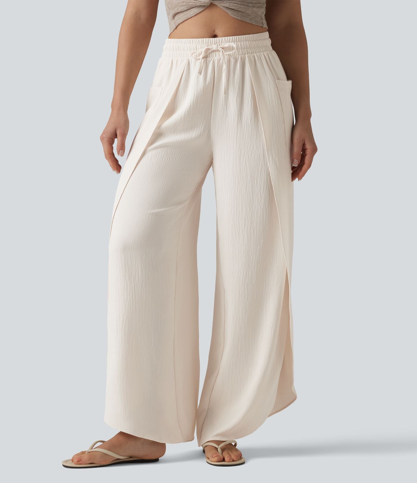 Pantalon ample décontracté à taille mi-haute, fentes, aspect lin, cordon de serrage et poches
