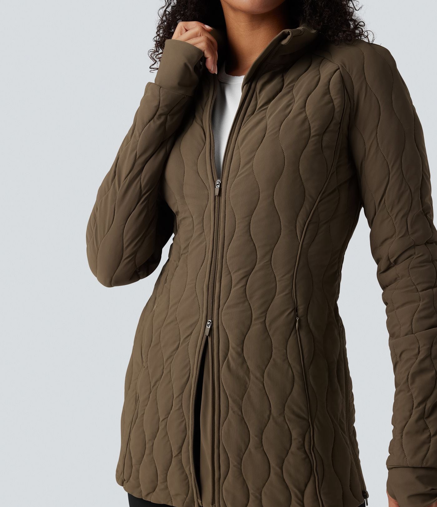 Veste matelassée de sport PuffFlex à col montant, manches longues, fermeture éclair avec passe-pouces et poches