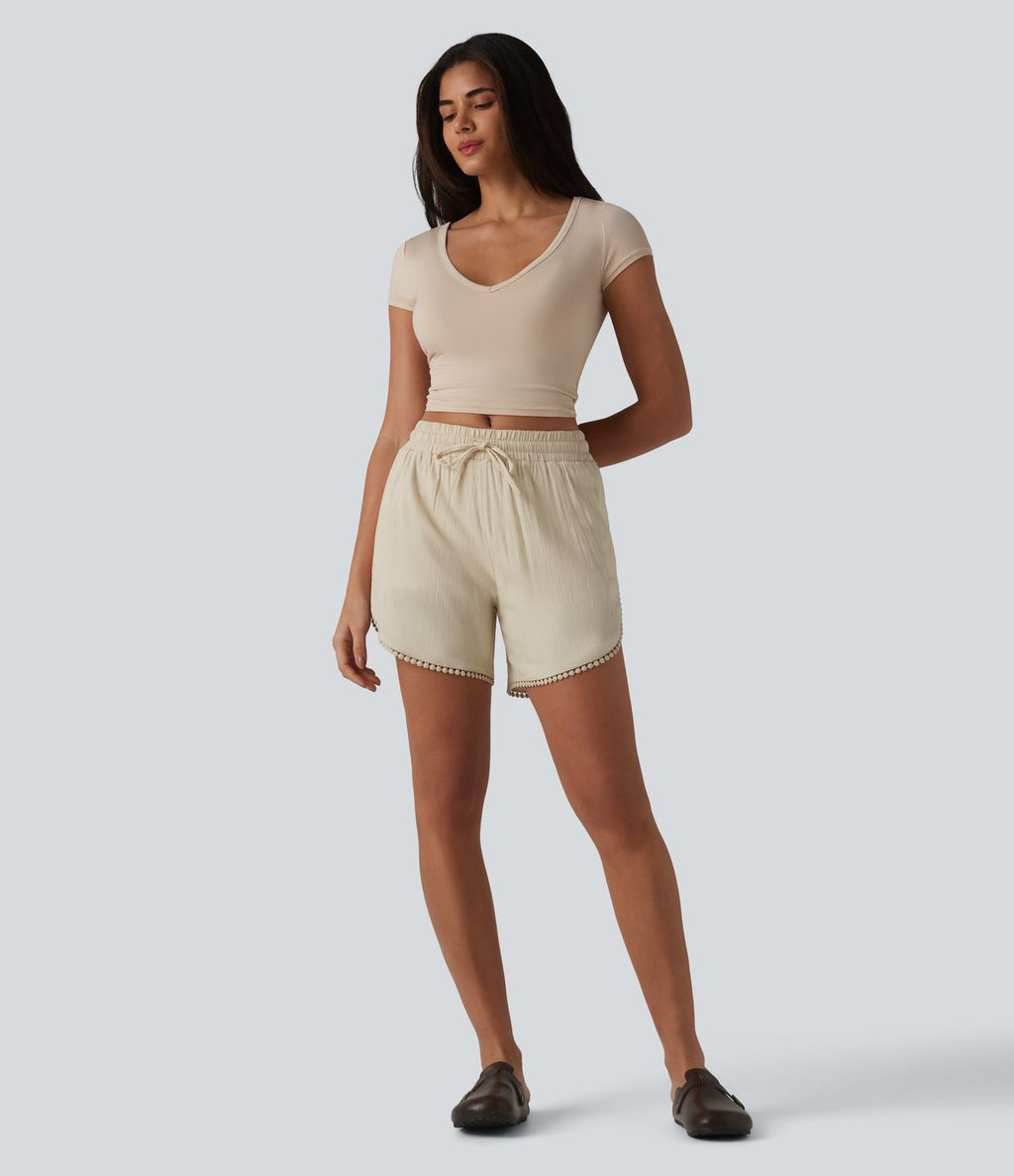 Short décontracté 2 en 1 à taille mi-haute, cordon de serrage, franges contrastées et ourlet arrondi