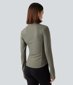 Haut de sport yoga polaire col montant demi-zip à manches longues avec passants pouces