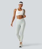 Brassière de sport d'entraînement maintien moyen col rond échancré dos nageur avec fermeture éclair, mesh contrasté et coussinets non amovibles
