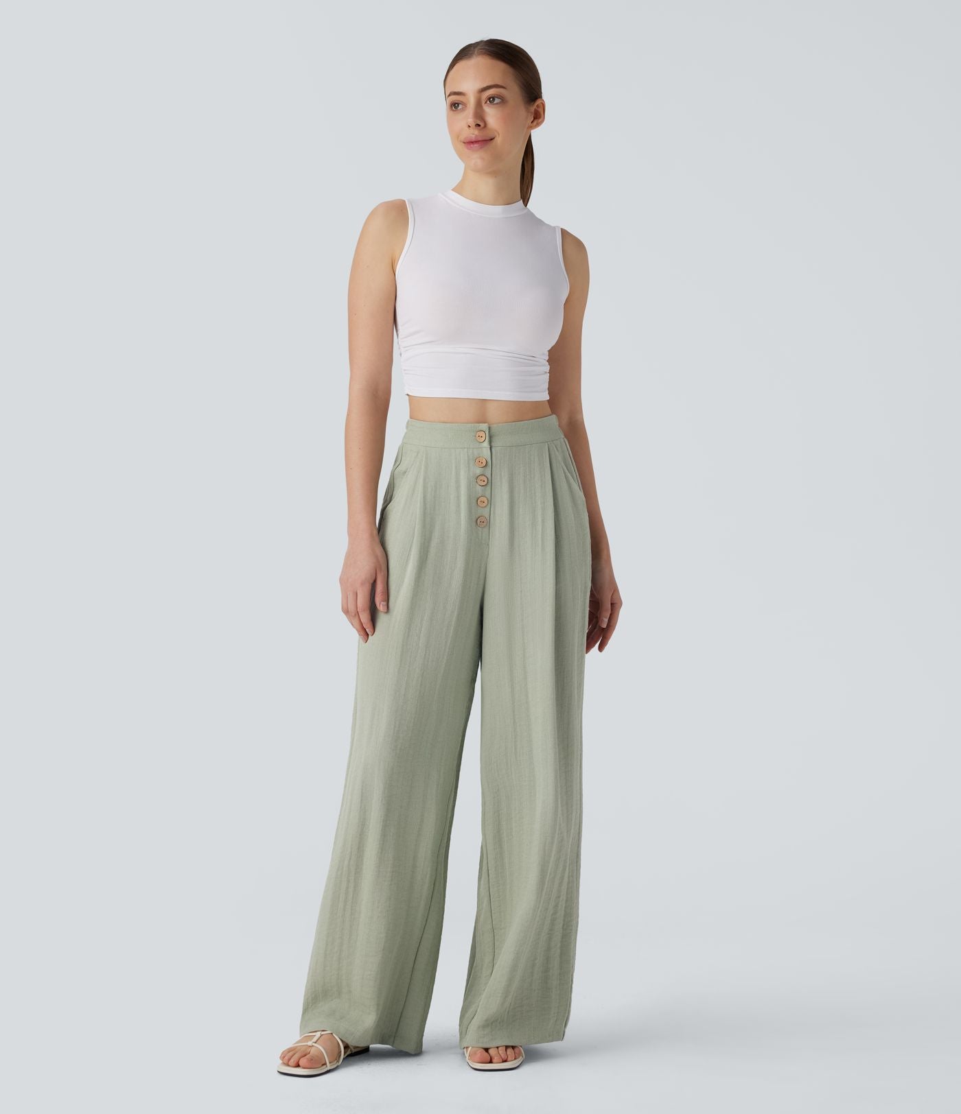Pantalon large et fluide aspect lin taille haute, boutonné avec poches