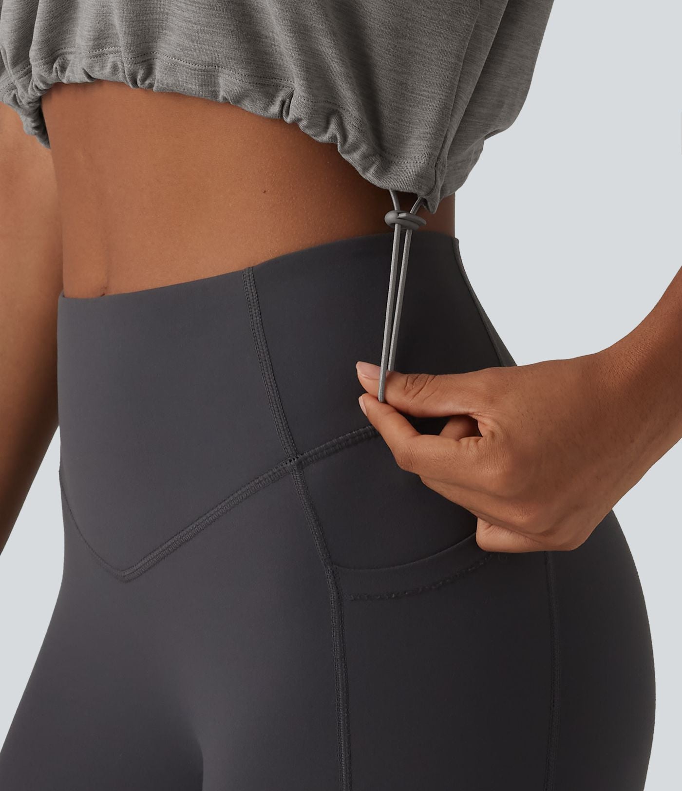 Débardeur de yoga court à capuche avec demi-zip