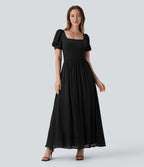 Robe longue de villégiature fluide à col carré, manches bouffantes, laçage et taille cintrée