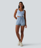 Short de sport 2 en 1 taille haute, cordon de serrage et œillets, en maille respirante