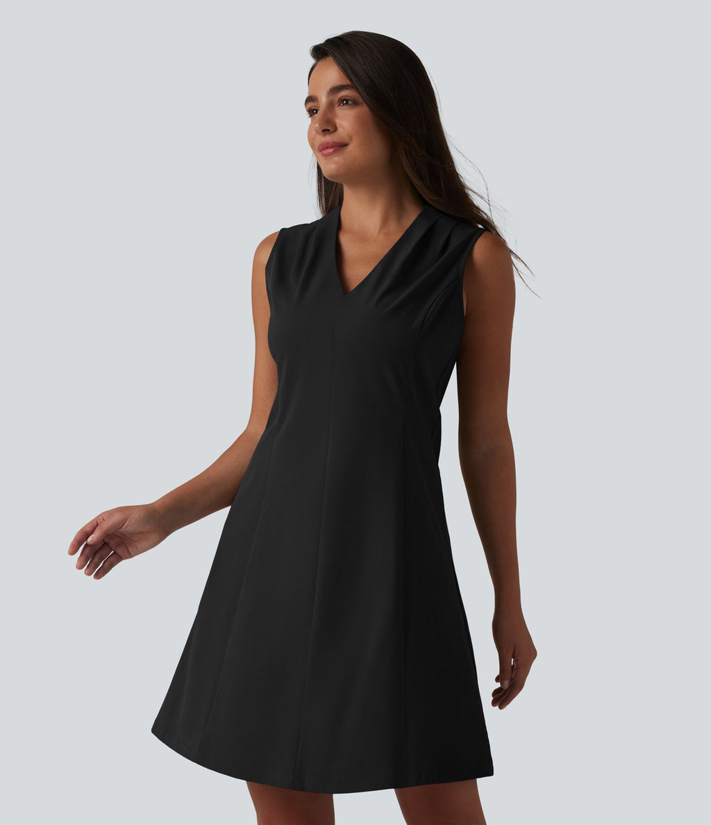 Robe de bureau mini en popeline stretch plissée col V sans manches avec fermeture éclair invisible et poches