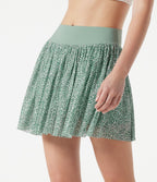 Jupe de sport mini 2-en-1 fluide taille mi-haute en mesh léopard avec poche