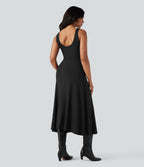 Robe mi-longue fluide col U sans manches avec poches