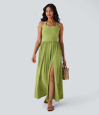 Robe longue fluide fendue avec poches latérales, dos nu et effet torsadé