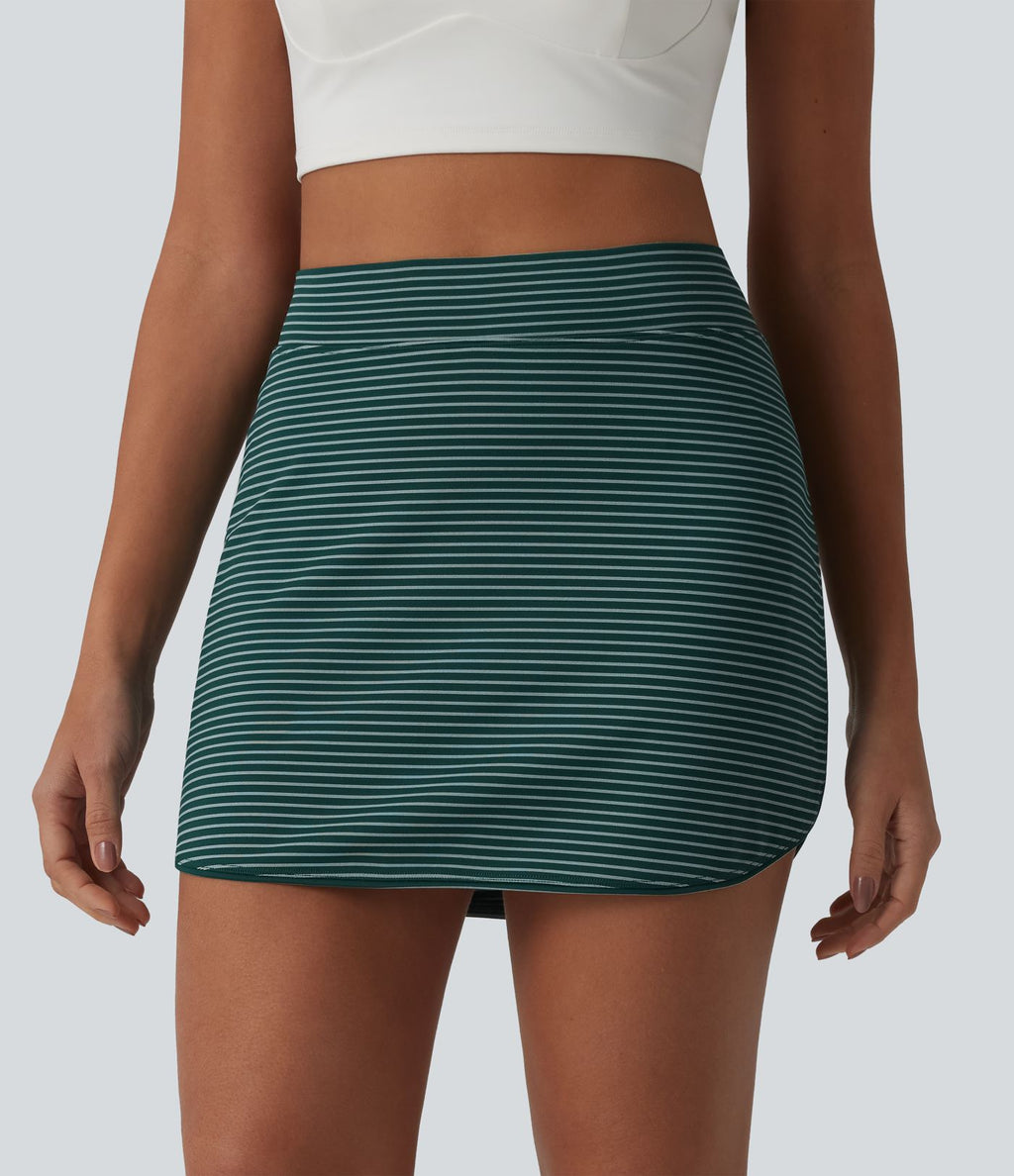 Jupe de golf mini moulante 2-en-1 taille haute à rayures avec poches