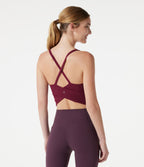 Caraco de yoga court col rond échancré avec brassière intégrée et ourlet croisé