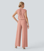 Combinaison pantalon tailleur jambes larges col montant dos goutte d'eau manches courtes avec poches latérales