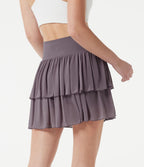Jupe-short tennis mini fluide taille haute croisée en mesh à volants, avec poches