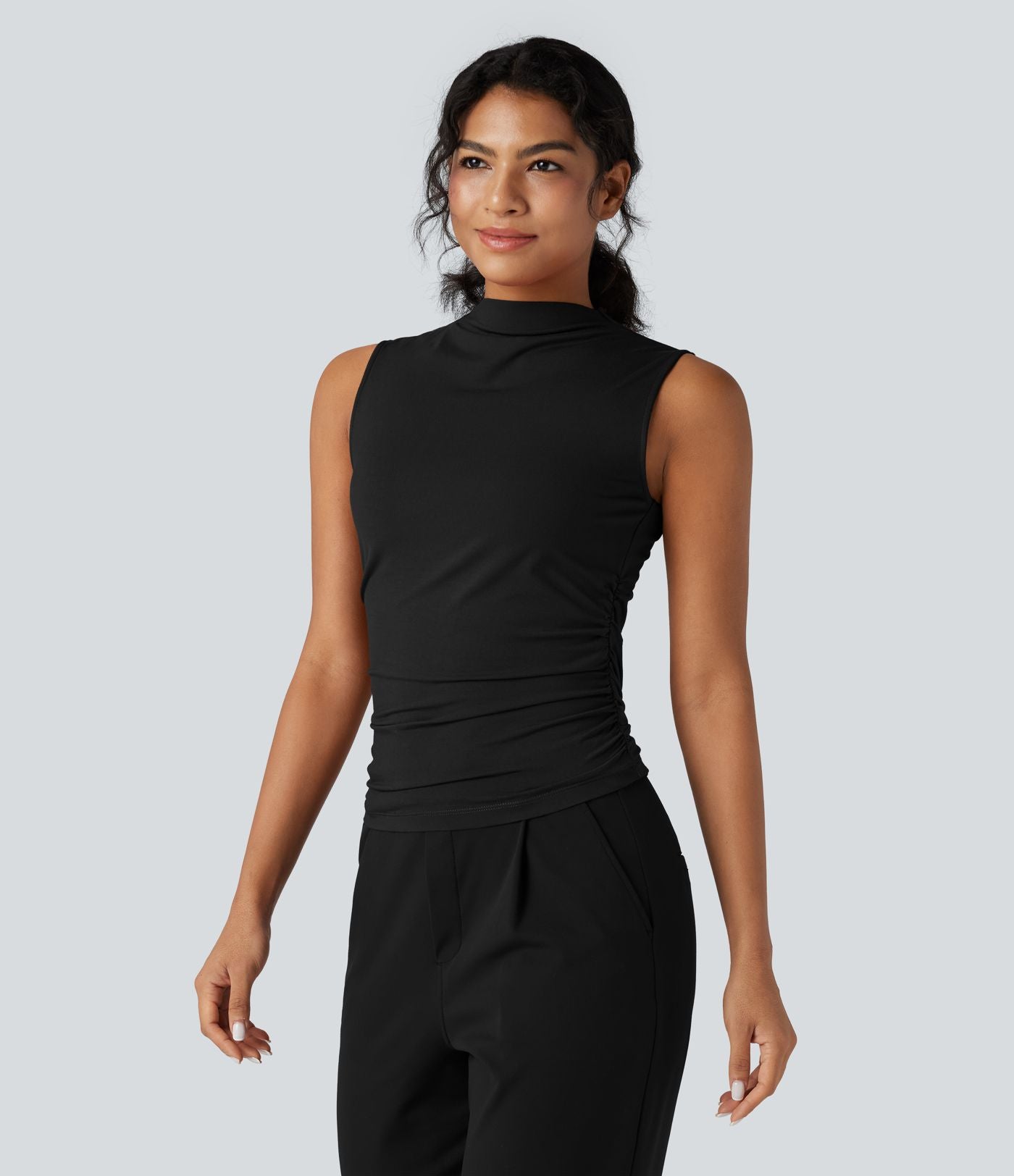 Top tailleur froncé col montant sans manches