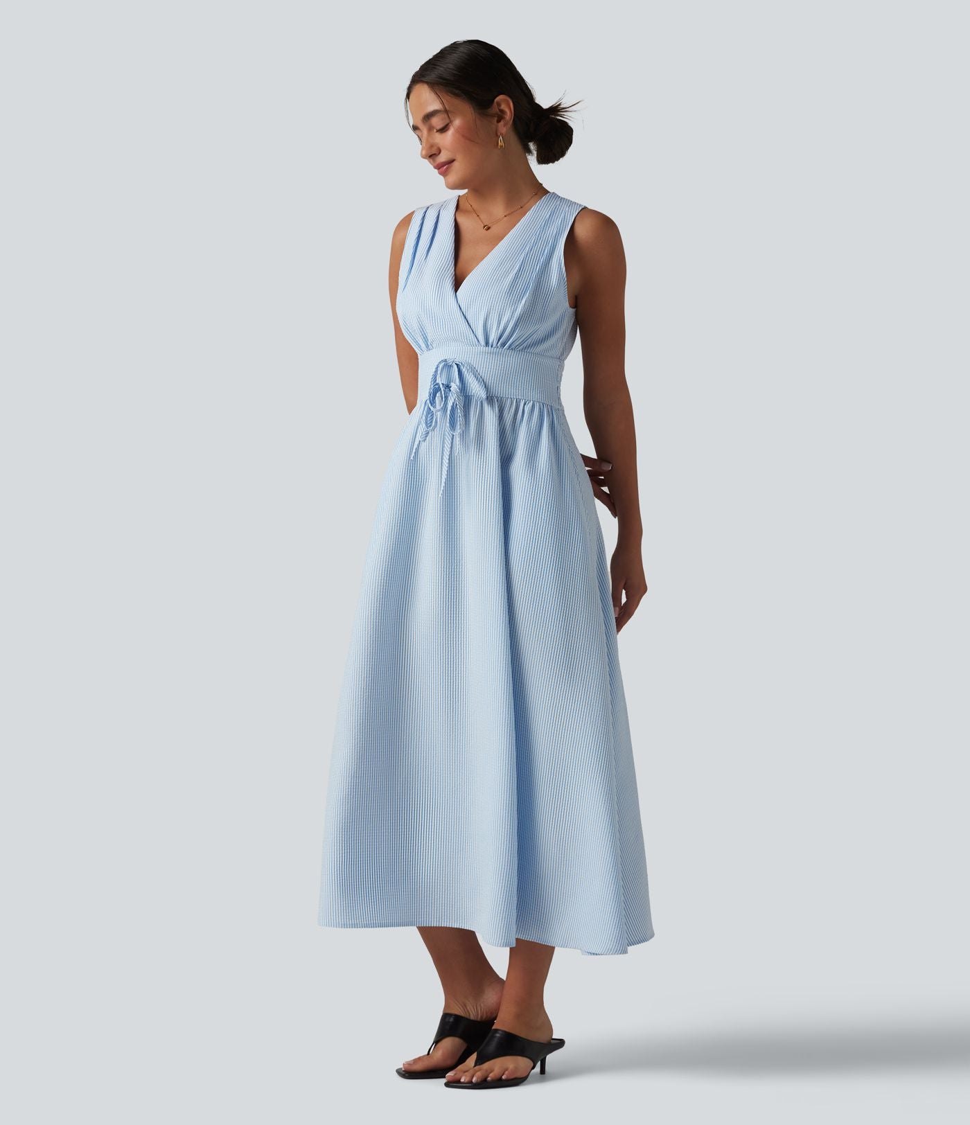 Robe midi rayée sans manches à col en V et poches