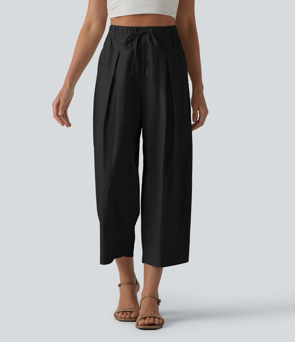Pantalon casual court en coton et lin taille haute coupe ballon avec cordon de serrage et poches