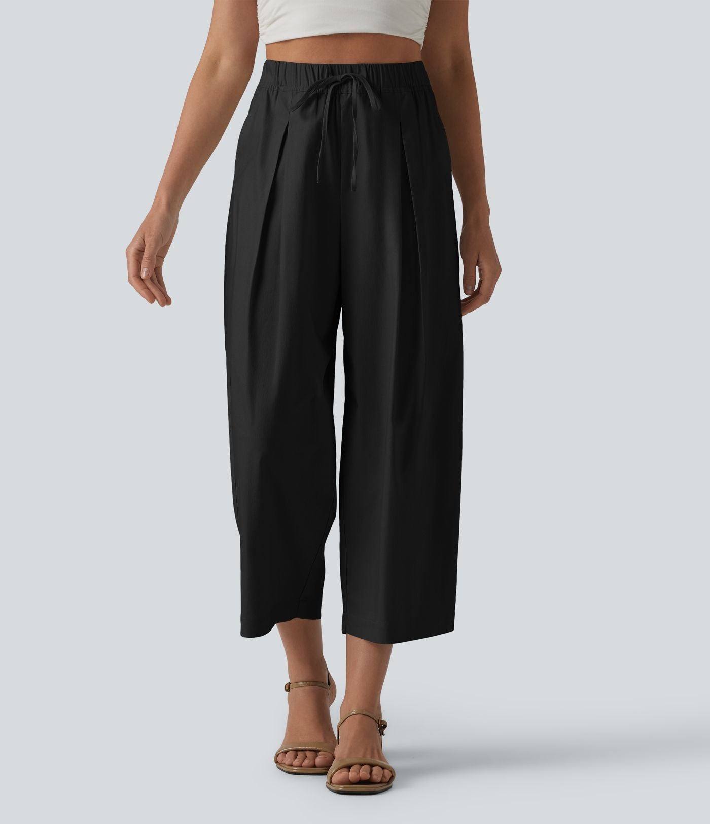 Pantalon casual court en coton et lin taille haute coupe ballon avec cordon de serrage et poches