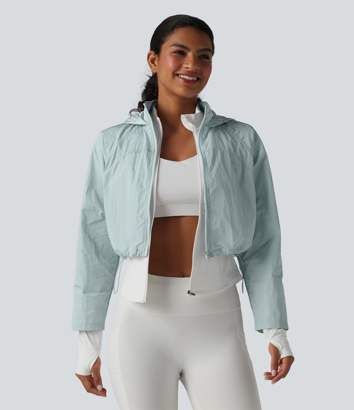 Veste de running 3-en-1 déperlante à capuche avec trous pour les pouces, ourlet arrondi et poches