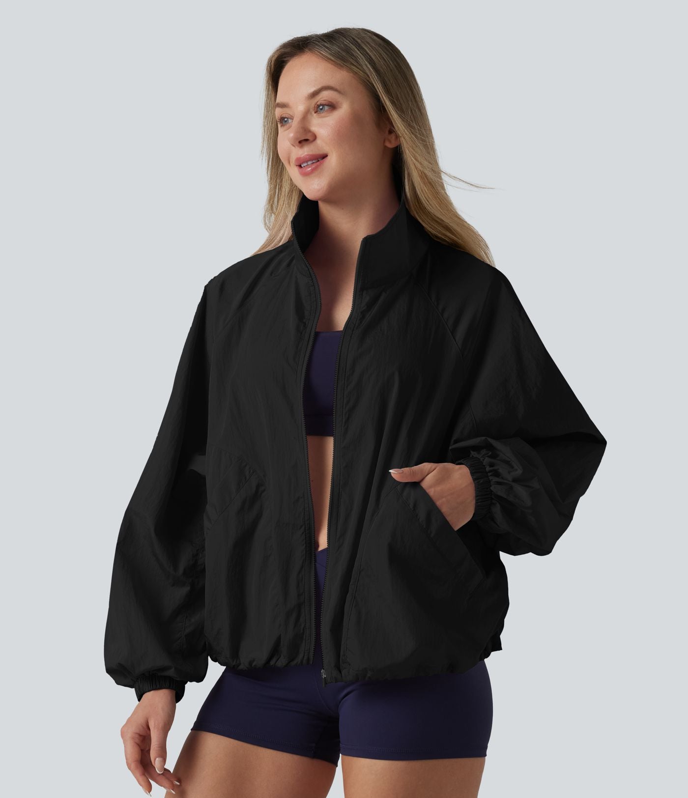 Veste de sport déperlante col montant manches longues zippée avec poches
