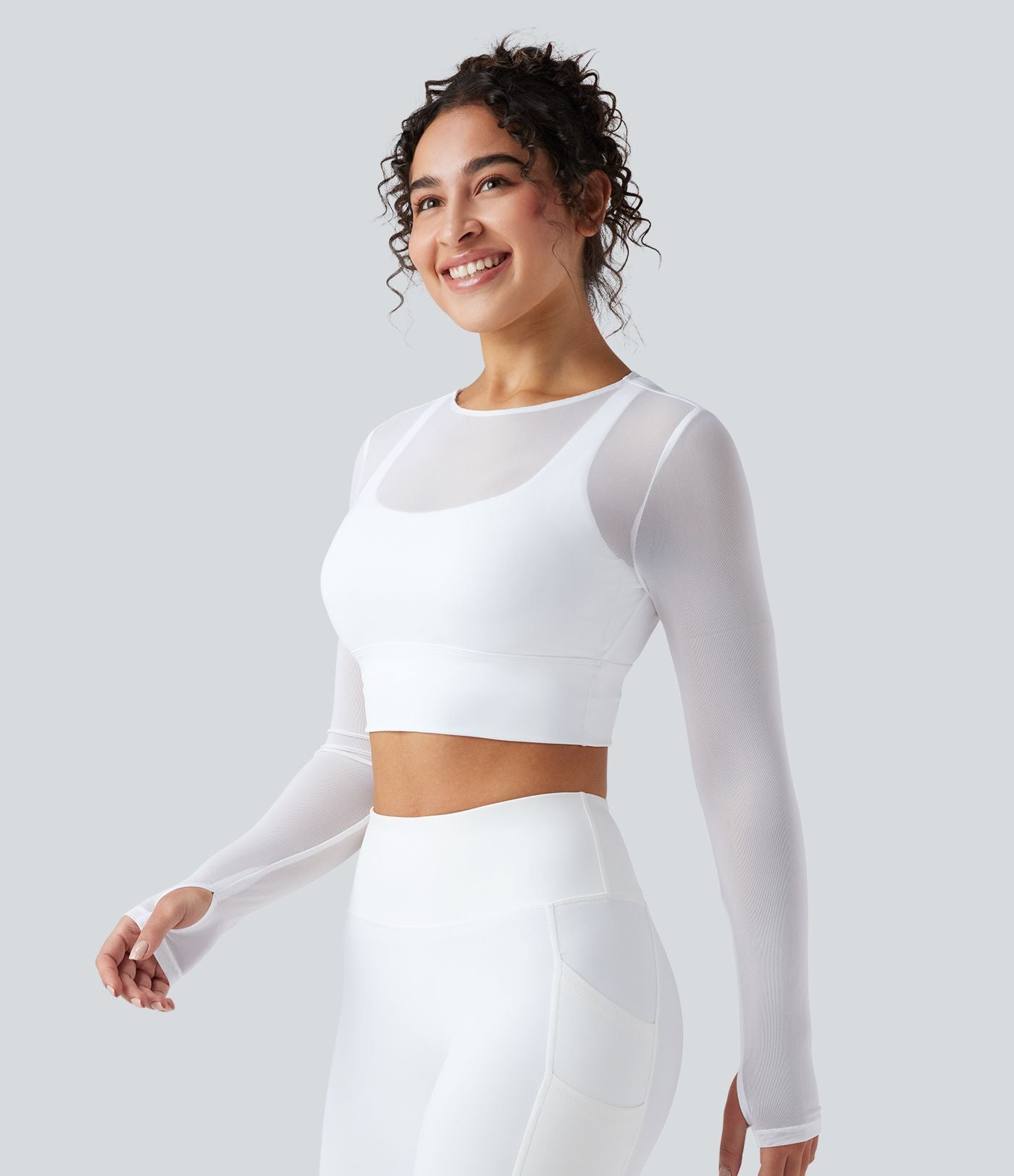 Haut de sport yoga cropped 2-en-1 manches longues mesh contrastant à trous pouces