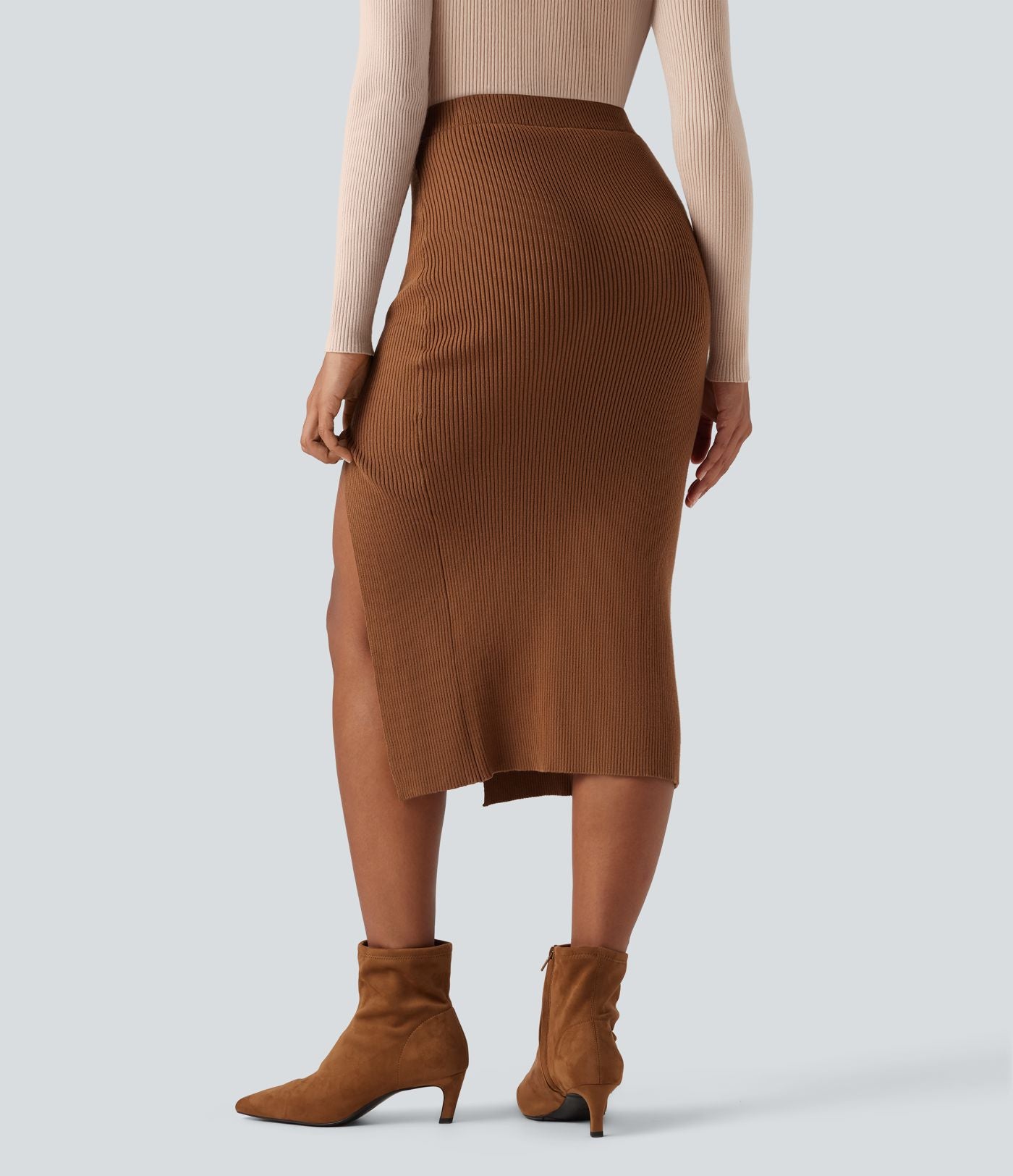Jupe pull mi-longue moulante fendue taille haute