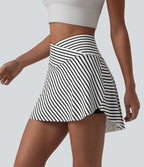 Jupe de tennis mini 2 en 1 à rayures, taille haute croisée, ourlet arrondi et poches