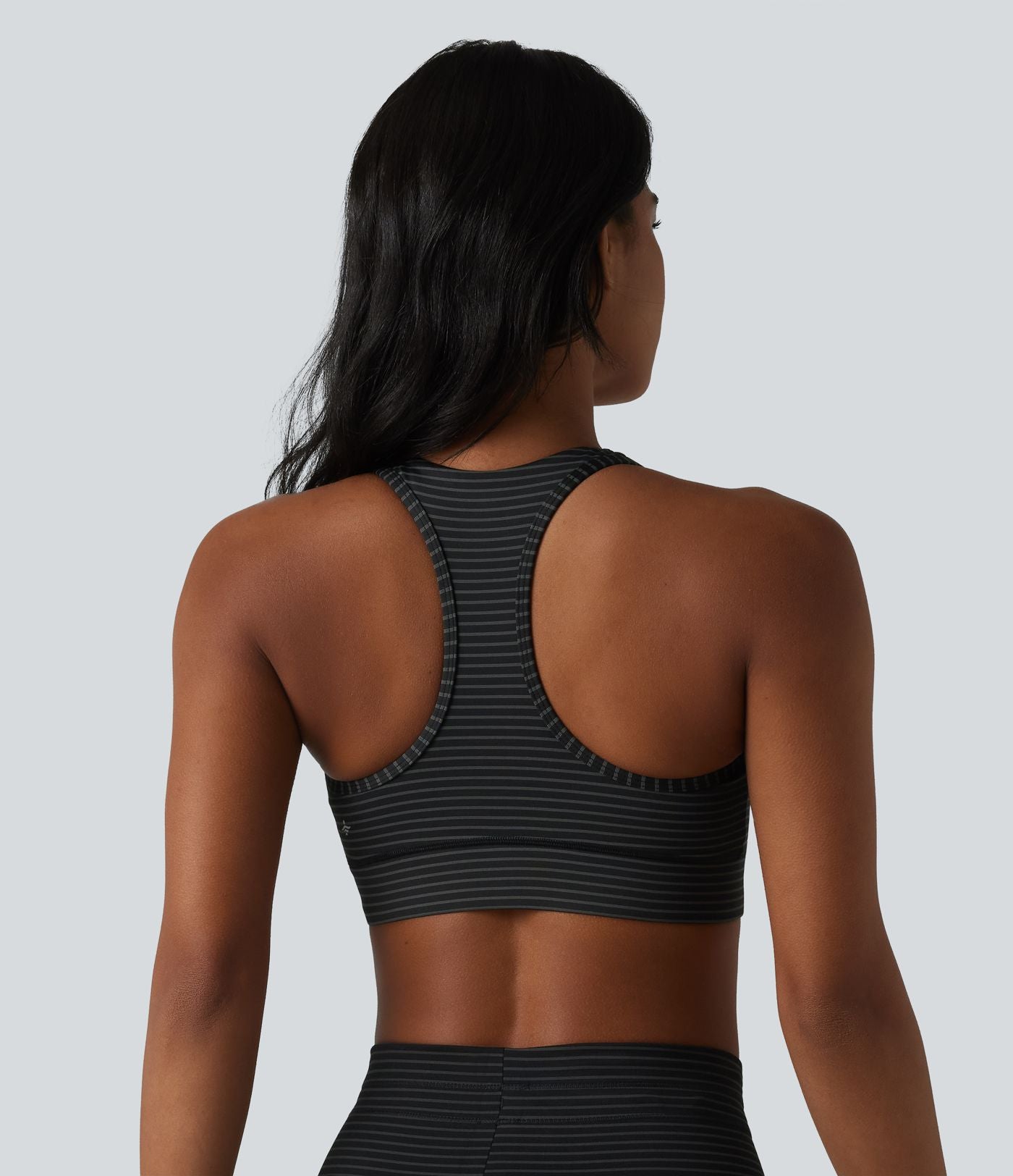 Brassière de sport col V dos nageur maintien moyen à rayures