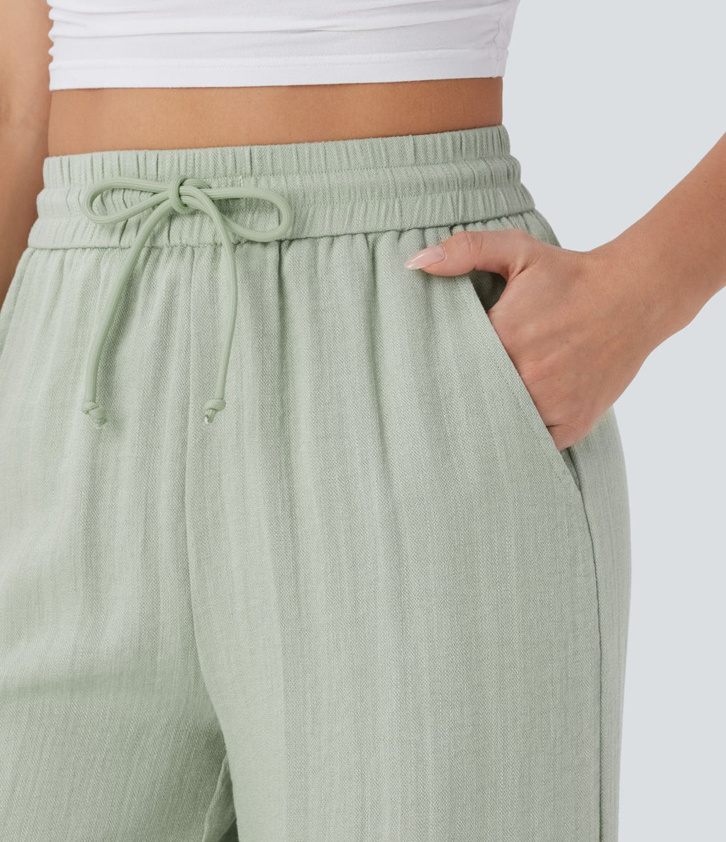 Pantalon large fluide taille haute avec cordon de serrage, poches latérales et aspect lin