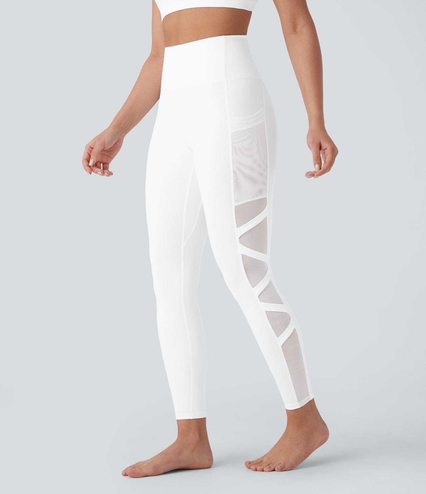 Legging de yoga 7/8 SpeedWave™ taille haute avec poches latérales et empiècements en mesh contrastés à séchage rapide