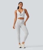 Brassière de sport push-up rayée à maintien léger, avec coussinets fixes, idéale pour le yoga.