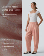 Pantalon décontracté coupe ballon taille mi-haute aspect lin avec poches