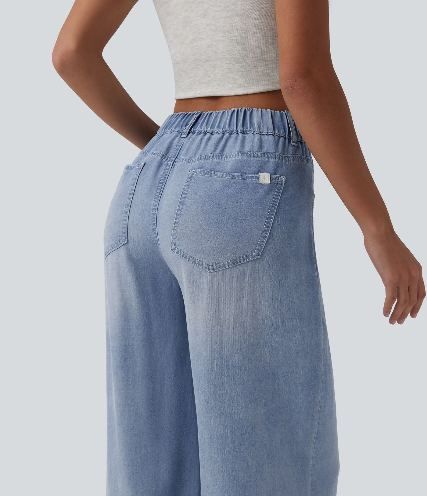 Jean large décontracté asymétrique en lyocell taille mi-haute drapé avec poches