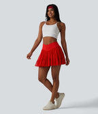 Jupe-short de tennis mini taille haute croisée fluide avec poches