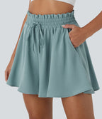 Short large décontracté taille haute façon paperbag avec cordon, poches latérales et aspect lin