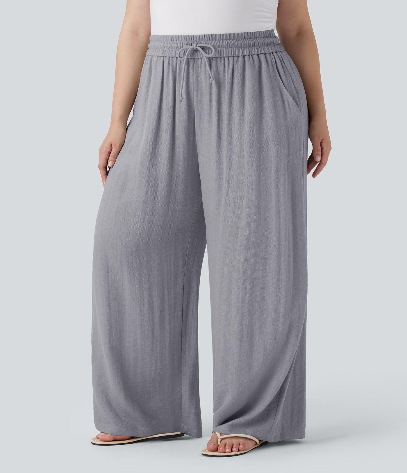 Pantalon décontracté grande taille large fluide taille haute effet lin avec cordon de serrage et poches