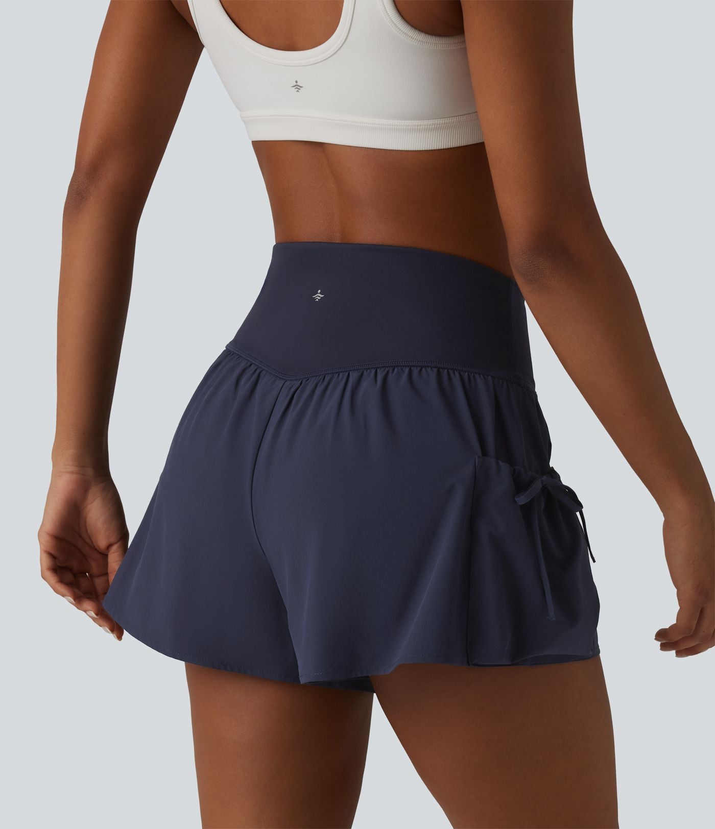 Short de sport ample 2 en 1 taille haute avec poches