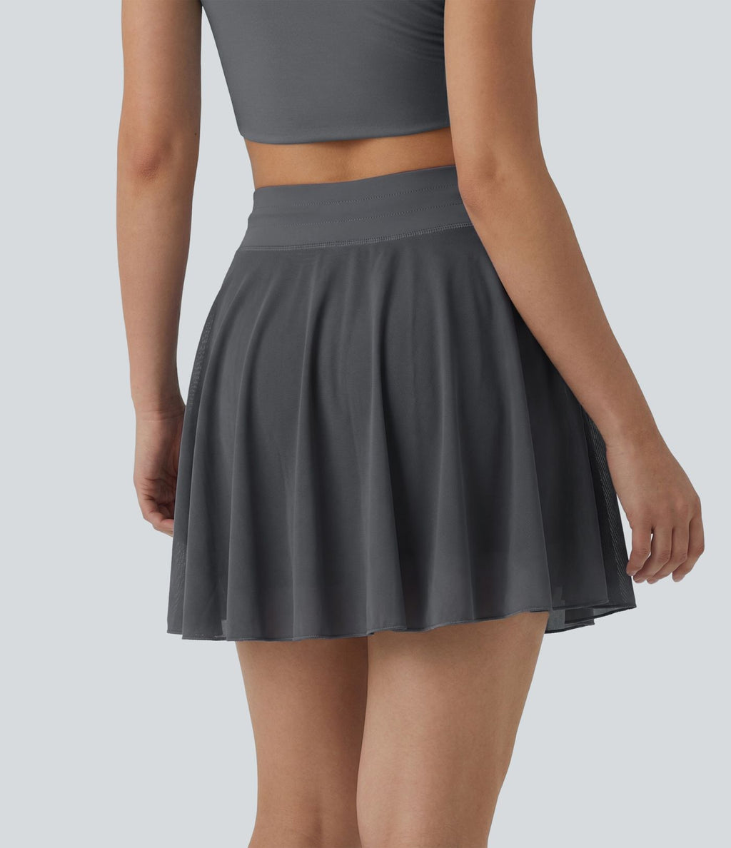 Jupe mini fluide évasée 2-en-1 taille haute à cordon, empiècements en mesh contrastant, avec poche, version plus longue
