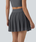 Jupe mini fluide évasée 2-en-1 taille haute à cordon, empiècements en mesh contrastant, avec poche, version plus longue