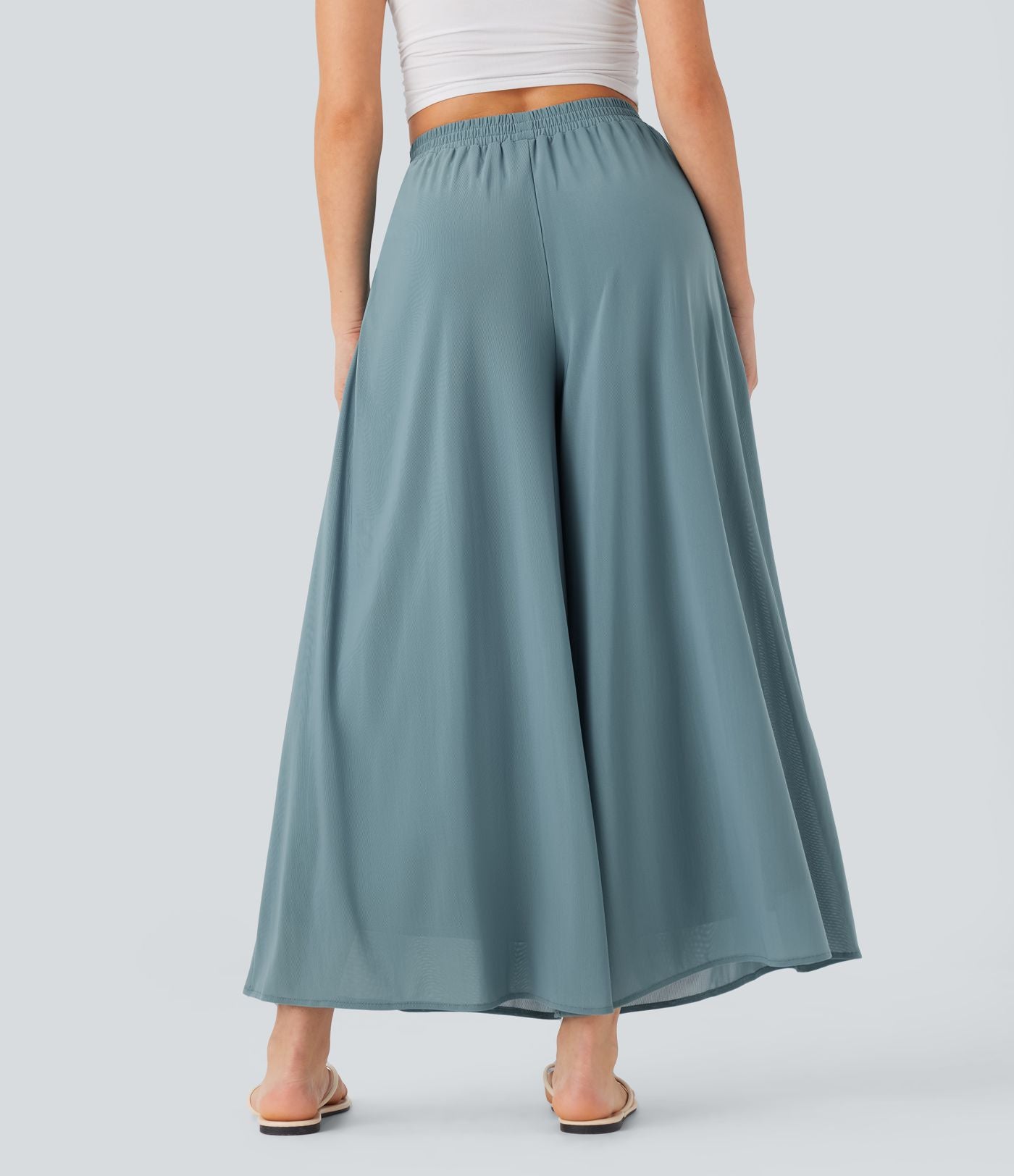 Pantalon fluide et ample avec superposition en mesh, poches latérales et taille haute