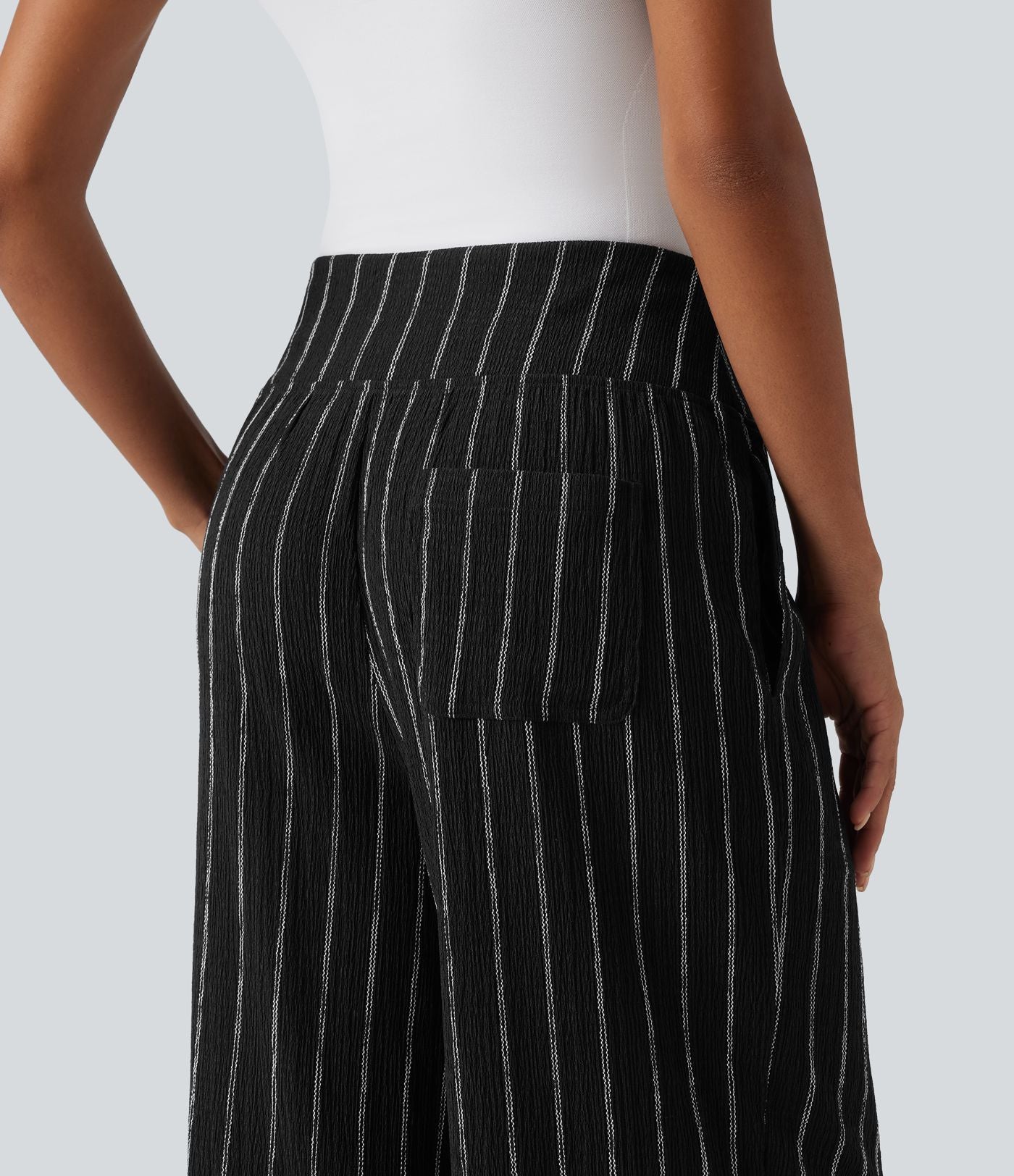 Pantalon rayé taille haute avec ourlet arrondi et poches