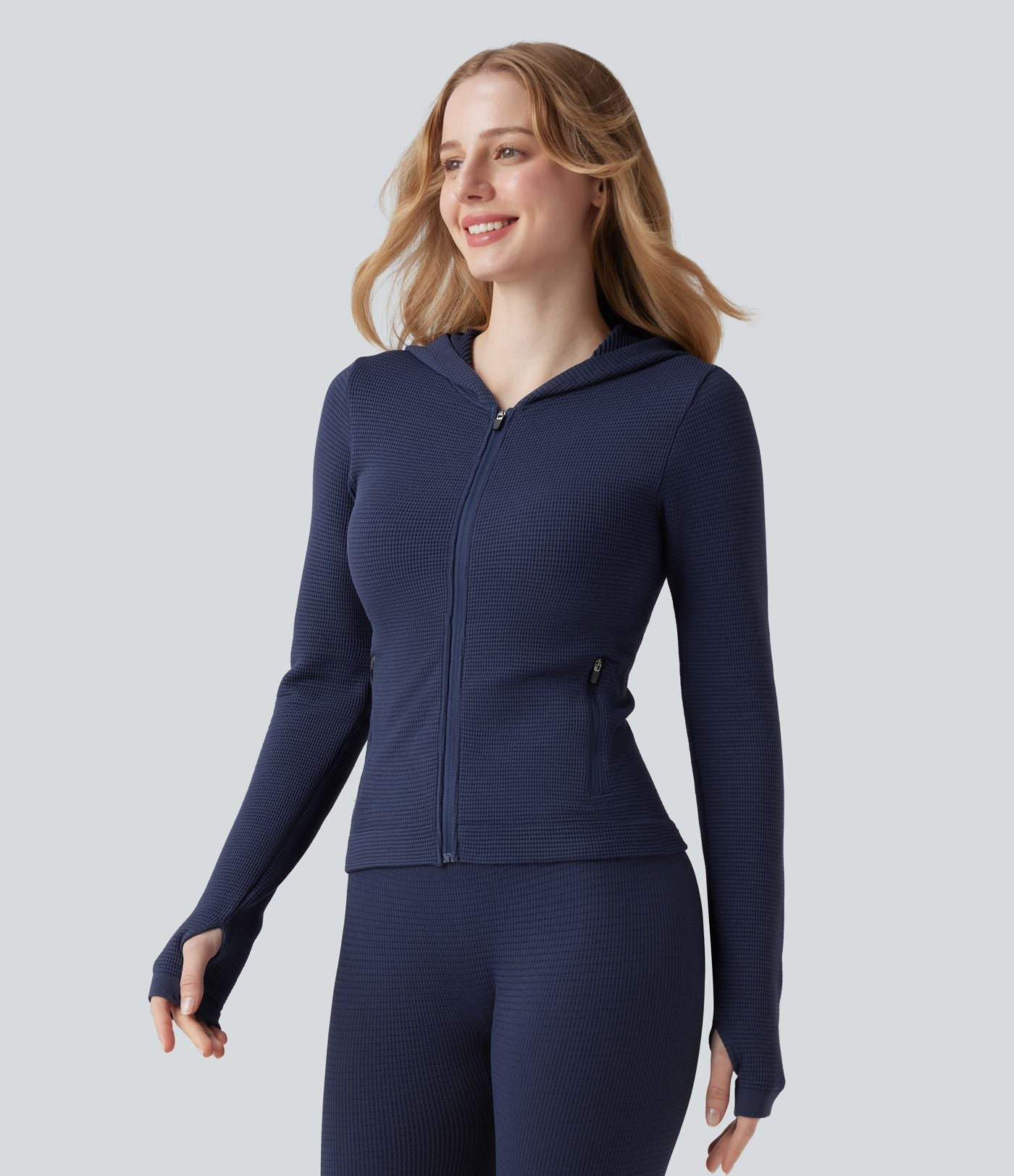 Veste yoga en maille gaufrée à capuche zippée à manches longues avec passants pouces sans couture OneForm Seamless Flow avec poches