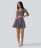 Jupe mini fluide évasée 2-en-1 taille haute à cordon, empiècements en mesh contrastant, avec poche, version plus longue