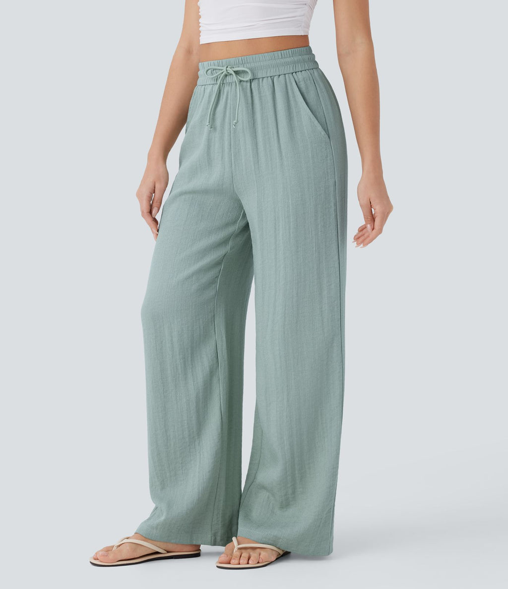 Pantalon large fluide taille haute avec cordon de serrage, poches latérales et aspect lin