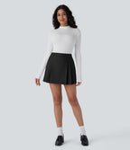 Mini-jupe plissée taille haute 2-en-1 avec fermeture éclair invisible
